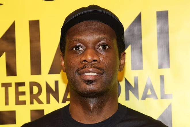 Fugees' Pras Michel turns himself in to authorities to begin 14-year prison sentence