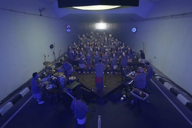 Tony Williams leads choir in a Jakarta tunnel ahead of Ye’s debut